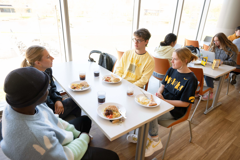 Four students sitting at a table