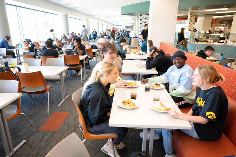 Four students sitting at a table