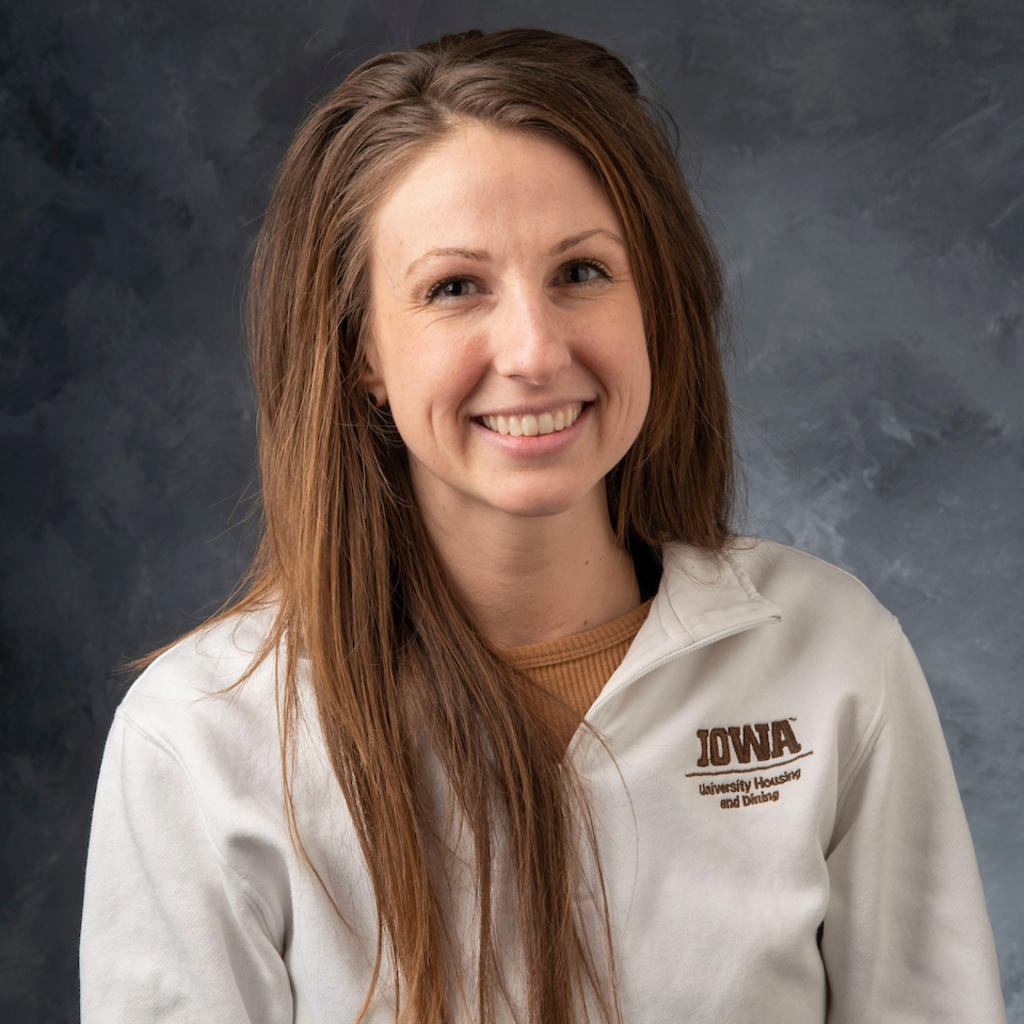 headshot of white woman with brown eyes and long brown hair