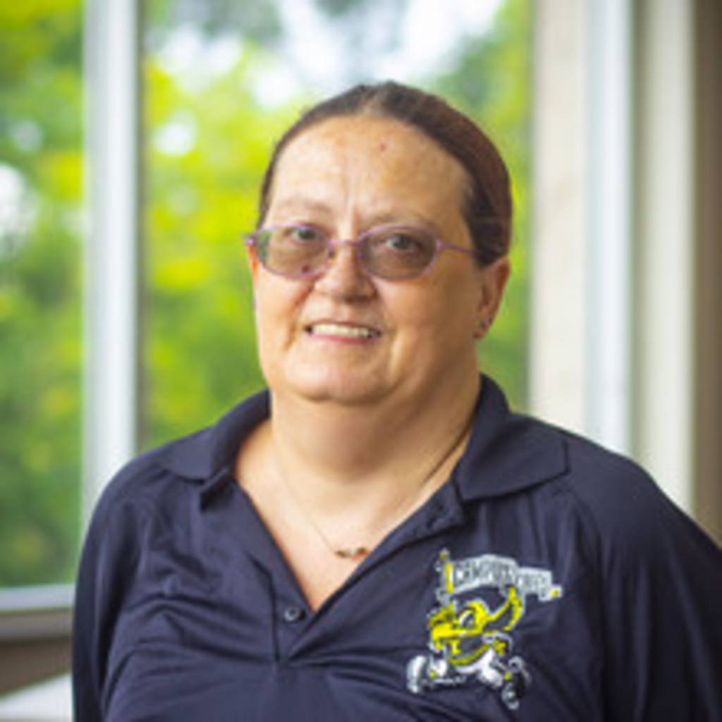 Woman wearing glasses and black Iowa t-shirt