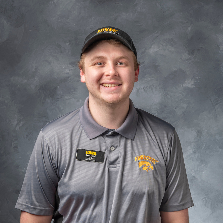 headshot of Evan Mural, assistant manager