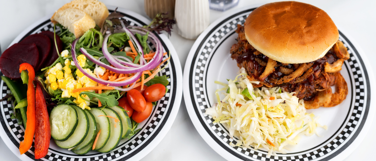 Two varied plates of food at Hillcrest